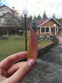 Midsection of person holding umbrella during autumn