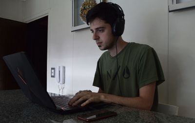 Man working on table at home