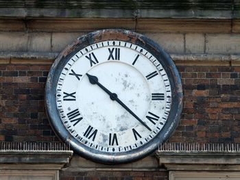 Close-up of clock on wall