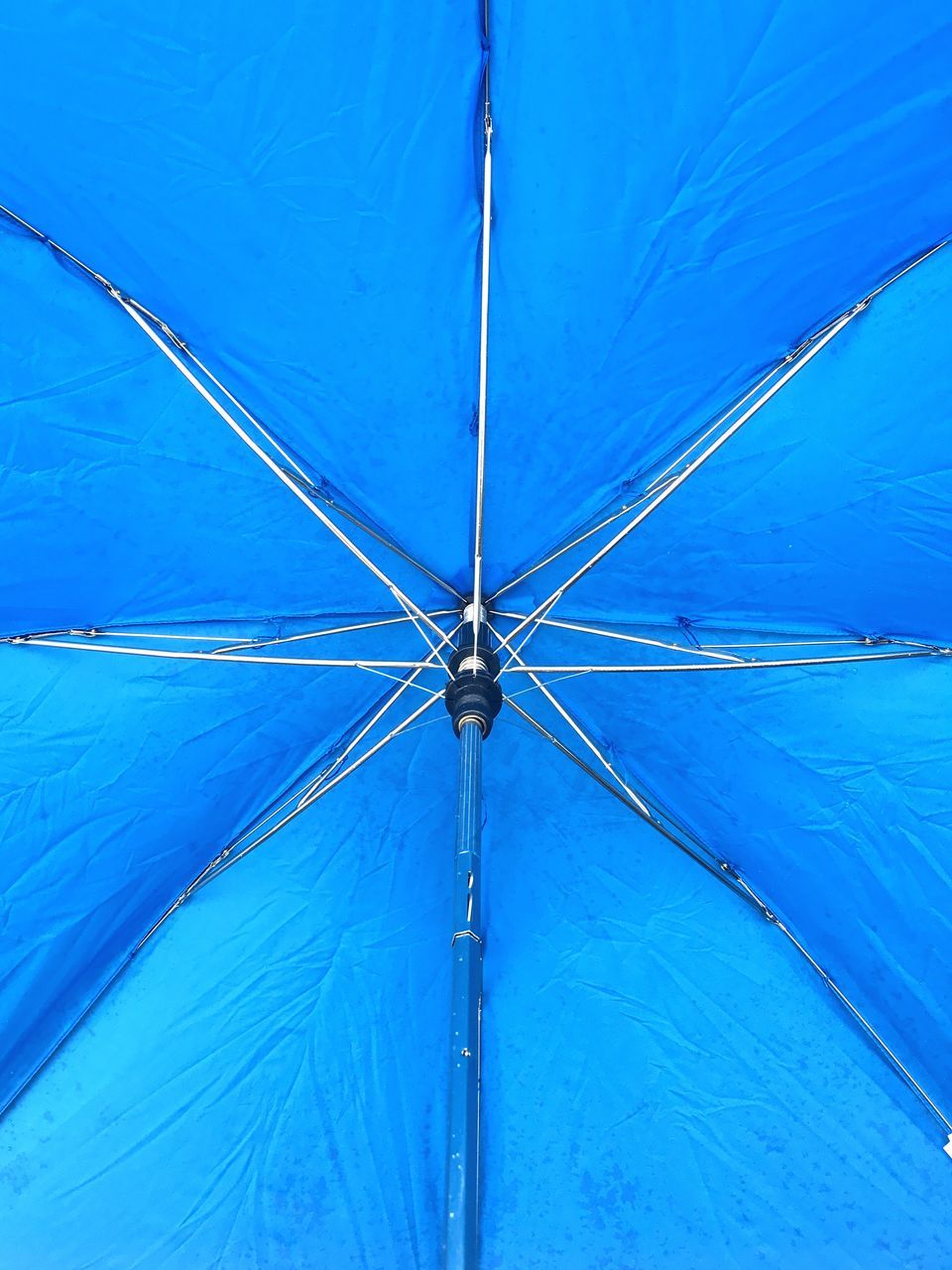 blue, full frame, no people, day, outdoors, protection, low angle view, backgrounds, shelter, symmetry, close-up
