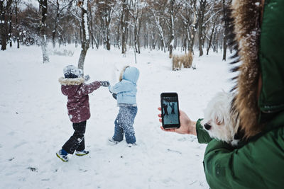 Fun games kids can play in the snow. outdoor winter activities for kids and family. mother