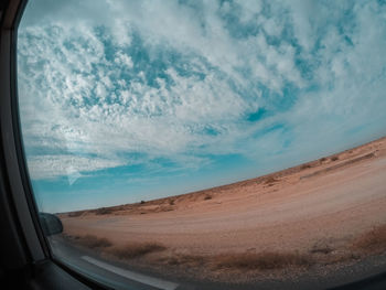 Scenic view of sky seen through car window