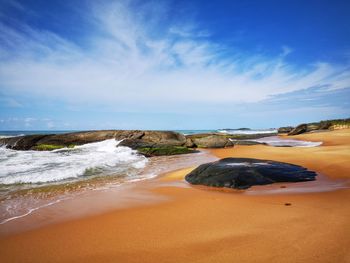 Scenic view of beach against sky