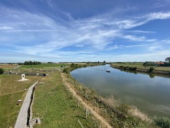 Panoramic view of landscape and lake against sky