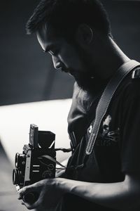 Close-up of a man holding camera