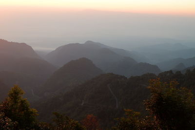 Scenic view of mountains against sky during sunset