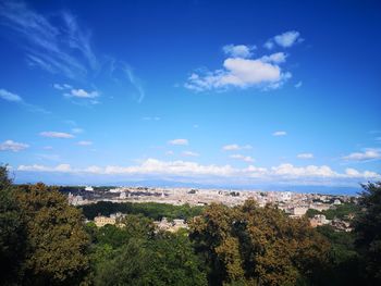 View of townscape against blue sky