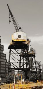 Low angle view of crane at construction site