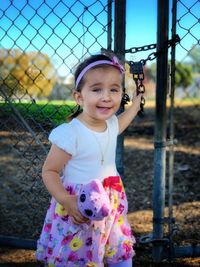 Portrait of cute girl standing outdoors