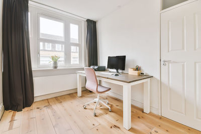 Woman sitting on floor at home