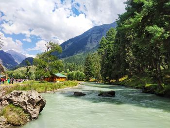 Scenic view of waterfall against sky