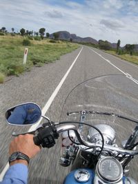 Man riding motorcycle on road