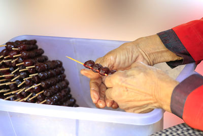 Close-up of person preparing food