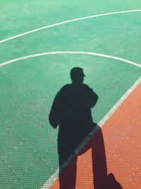 Shadow of man at basketball court