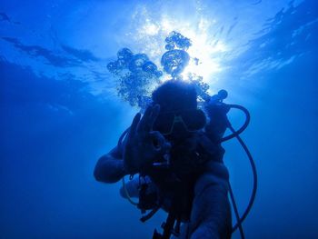 Low angle view of person swimming in sea