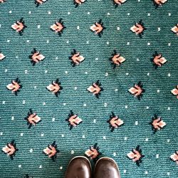 Directly above shot of shoes on carpet