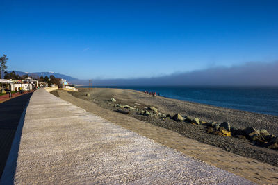 Scenic view of sea against blue sky