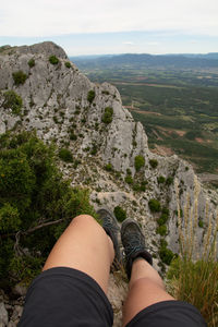 Low section of woman on rock