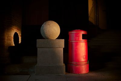 Bollard on street at night