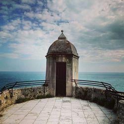 Scenic view of sea against cloudy sky