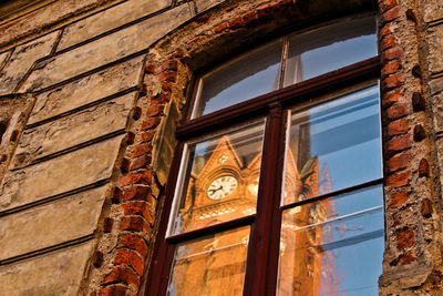 Low angle view of window against sky