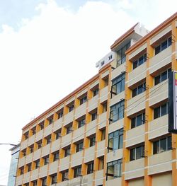 Low angle view of apartment building against sky