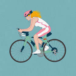 Side view of woman riding bicycle against clear sky