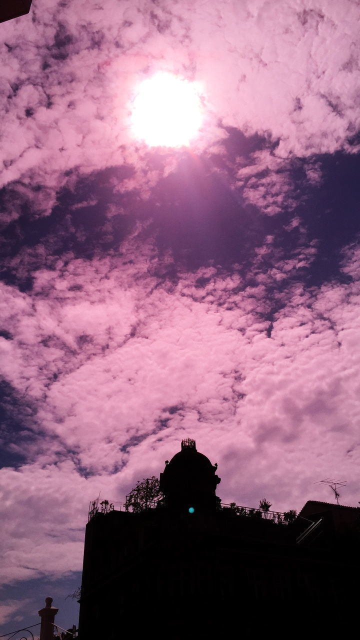 building exterior, architecture, built structure, low angle view, silhouette, sky, cloud - sky, sunset, sun, building, sunlight, cloudy, cloud, outdoors, sunbeam, no people, house, nature, dusk, high section