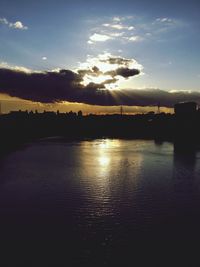 Scenic view of lake at sunset