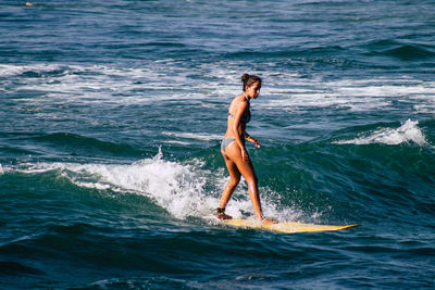 Side view of woman in sea