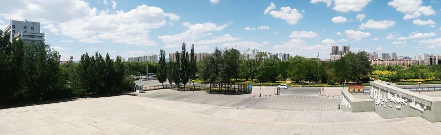 View of city against cloudy sky