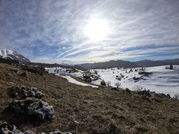 Scenic view of snowcapped mountains against sky