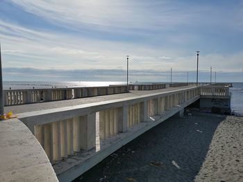 Pier over sea against sky