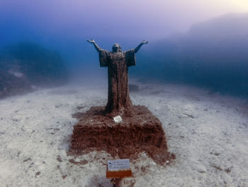 The statue of jesus christ near the wreck of the mv imperial eagle in malta