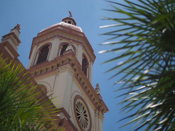 Low angle view of bell tower against sky