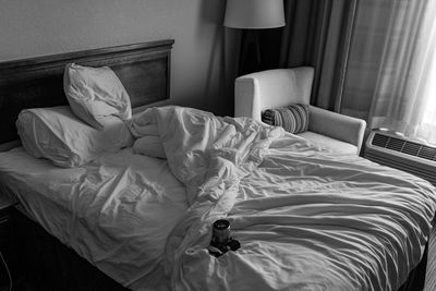 Empty bed in hotel with camera 