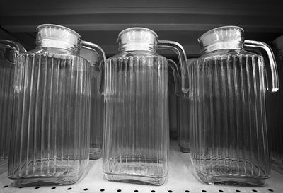 Close-up of glass jar on rack