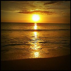 Scenic view of sea at sunset