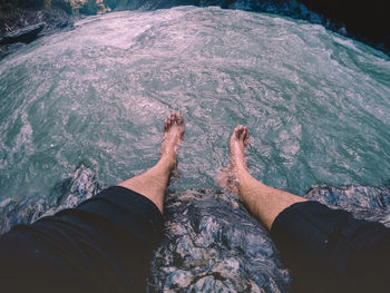 Point of view of man sitting by the river