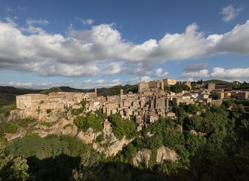 Panoramic view of buildings in city against sky