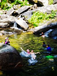 People swimming in lake