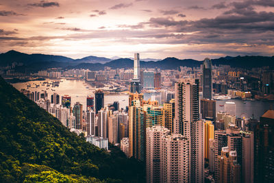 Panoramic view of city and buildings against sky during sunset