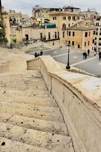 Road by buildings in city