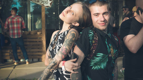 Young couple standing in city