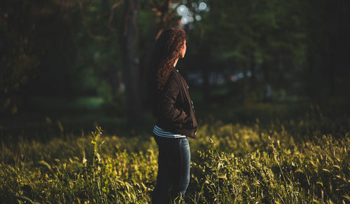 Side view of person standing on field