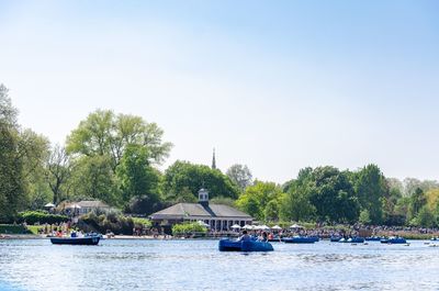 Boats on the serpentine lake at hyde park in summer, london