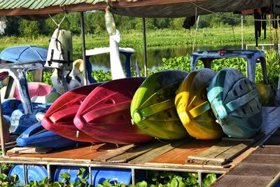 Close-up of multi colored deck chairs on grass