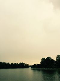 Scenic view of calm lake against clear sky