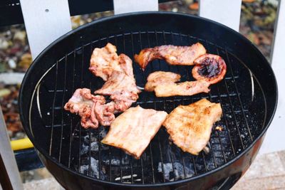 High angle view of meat on barbecue grill