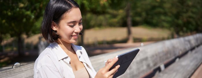 Young woman using mobile phone